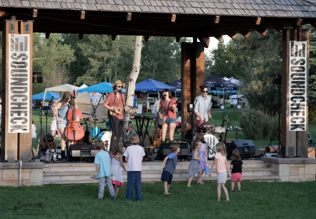 Stage view with kids in front of band performing at Soundcheck Summer Music Series in Pinedale, WY